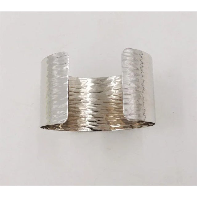 This is part of Chairish’s Costume Jewelry assortment. Rhodium plated cuff bracelet. Marked "Napier." Circa 1976-77 based...