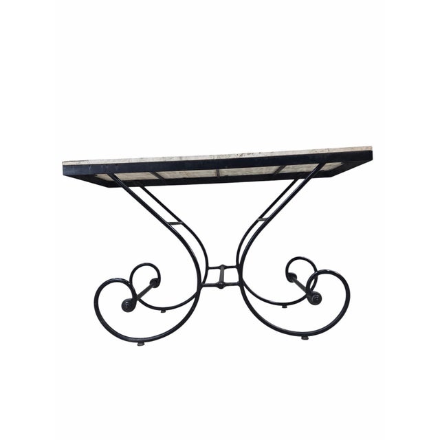 Hollywood Regency Stone Top Table with Sculptural Wrought Iron Scroll Base Vintage Hollywood Regency table featuring a...