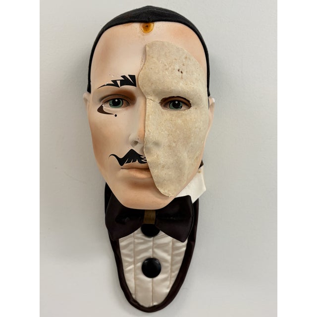 Large decorative wall mask inspired by The Phantom of the Opera, featuring a tuxedoed figure with half-face plaster mask...
