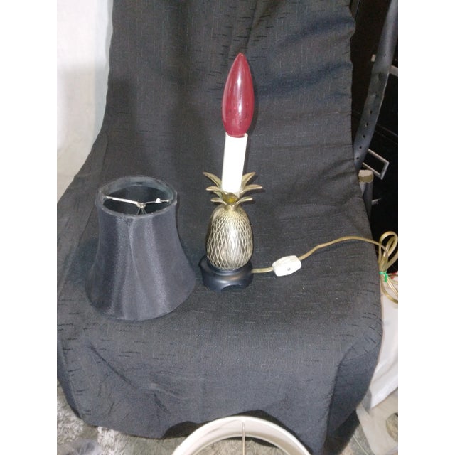 This is a Mid Century 1960's solid brass pineapple lamp mounted on a solid steel black base and it comes with it own black...