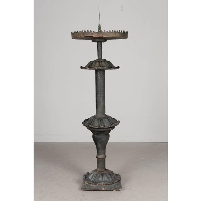 An early 19th century French garden sundial with heavy cast iron column base and carved marble dial plate with bronze...