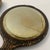 This three‑piece vintage vanity set includes a hand mirror, hairbrush, and powder brush, each featuring ornate faux antler...