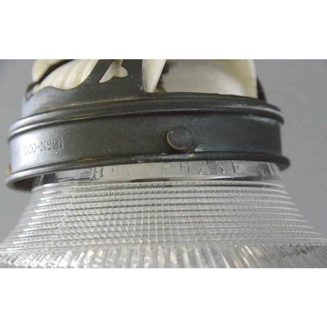 Articulated Wall Sconce By Holophane Circa 1910 - Articulated curved brass arms - Fluted prismatic shade - Takes E27...