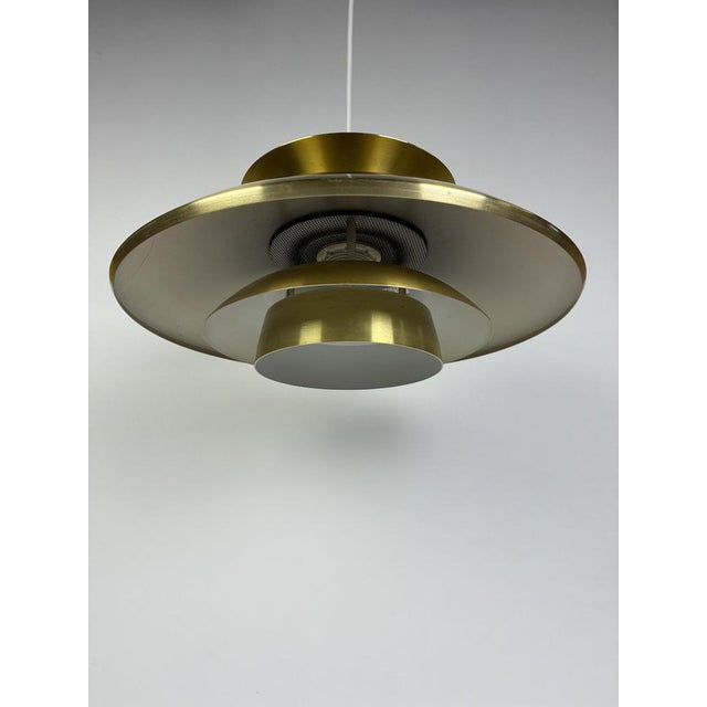 Danish Pendant Lam in Brushed Aluminium, 1970s, in Good conditions. Designed 1970 to 1979 This piece has an attribution...