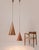 Elegant pair of danish hand-hammered copper cone pendant lamps hanging on long chains. Designed and manufactured by e.s...