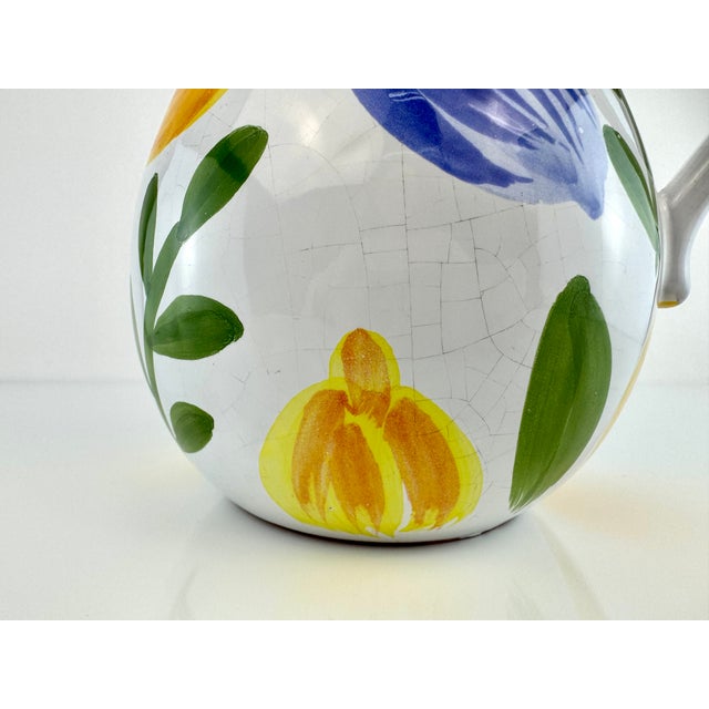 This vintage Mid Century pitcher from Portugal is a celebration of Mediterranean charm, featuring hand-painted plums and...