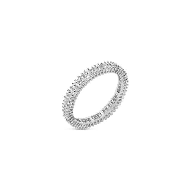 Immerse yourself in the timeless elegance of this 10K white gold eternity band, a testament to enduring love and...