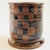 A vintage studio pottery mug. Two toned brown glaze with a checkered pattern to the front. Signed PK on the base.