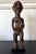 A finely carved Lwalwa maternity figure holding a baby from Democratic Republic of Congo in Central Africa circa 20th...