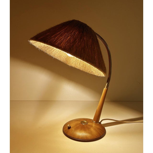Vintage desk lamp featuring a sisal shade mounted on a brass flex stem, teak futteral and base with star shaped veneer...