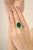 This luxurious cocktail ring showcases a certified 13.17 ct oval-cut emerald, surrounded by a 3.39 ct sparkling halo of...