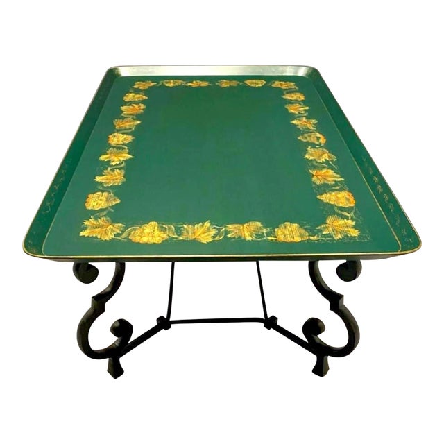This is a mid-century hand painted Maison Ramsay wood and iron tray top coffee table with tole style paint decoration. The...