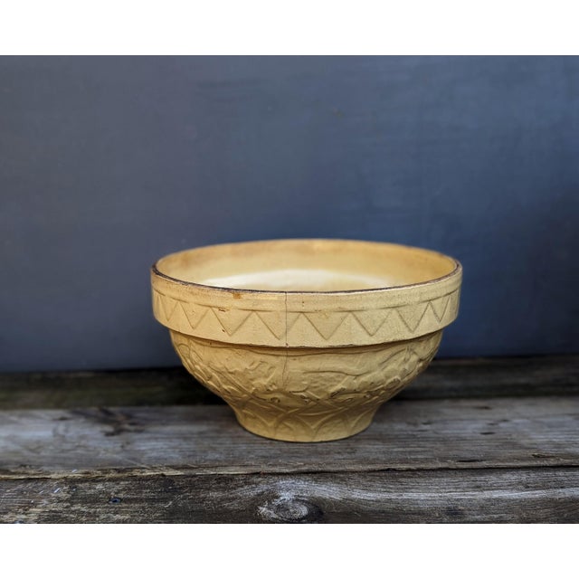 Antique rustic buttercream yellow stoneware bowl. This beautiful piece of history comes well worn with significant aging...