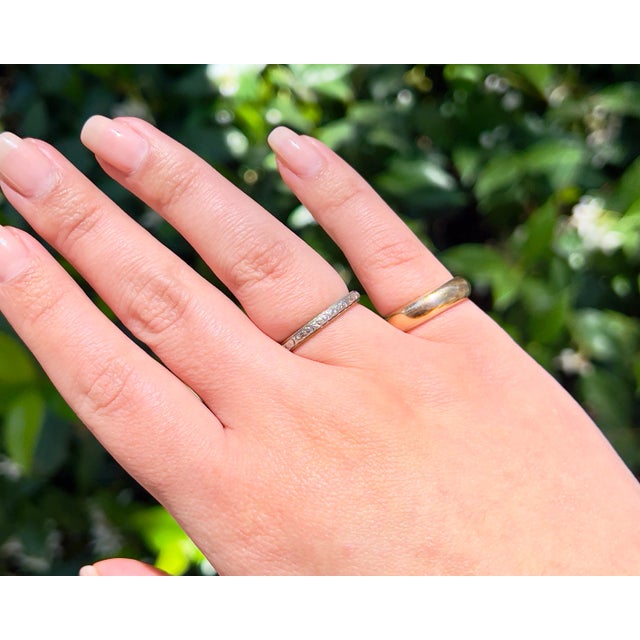 About This Ring This antique gold chunky band features an elegant inscription of "H. to M. July 14- 1909". Crafted with...
