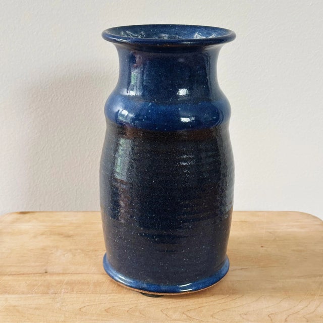 MId-Century Hand Thrown California Studio Pottery Vase in Blue Glaze in unique form and ribbed neck Measures approx: 9.5H...