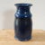MId-Century Hand Thrown California Studio Pottery Vase in Blue Glaze in unique form and ribbed neck Measures approx: 9.5H...