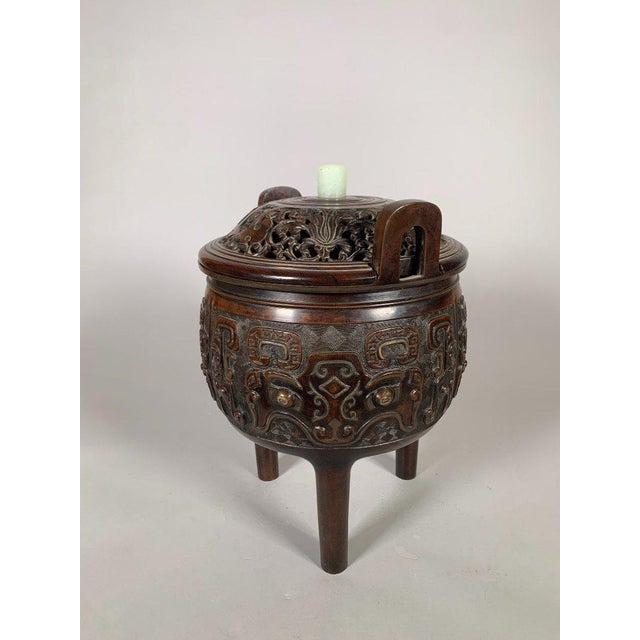 Large bronze incense burner, 18th-19th century, China, Qing dynasty. In the Song dynasty style. Carved bronze with archaic...