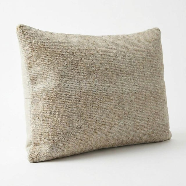 This beautiful 13'' x 20'' pillow cover was made from an authentic Turkish rug. Bright colors of wool adorn the front of...