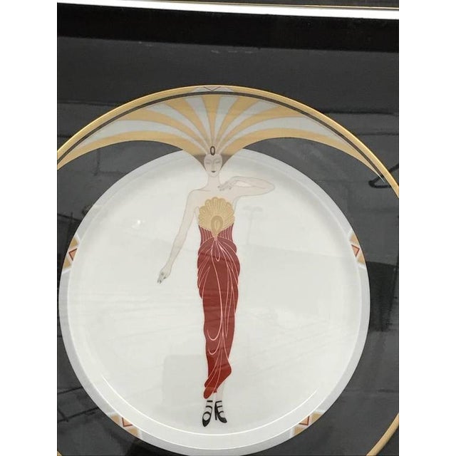 Stunning Erte (Russian 1892-1990) framed collector plate "LE SOLEIL". Framed in an ebony and gold motif. Romain de Tirtoff...