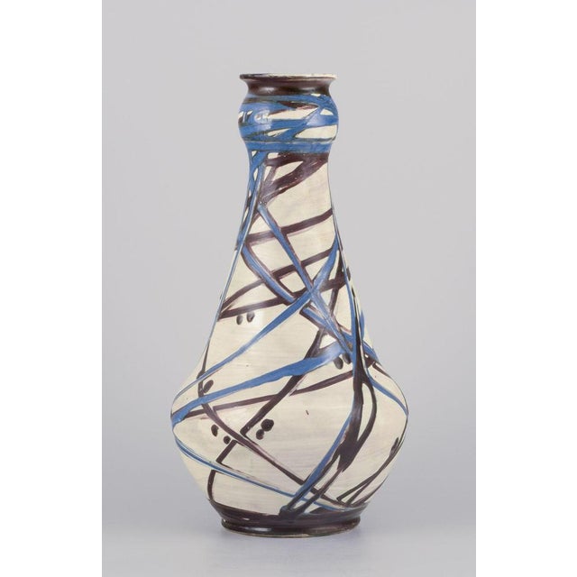 Kähler, Denmark. Large floor vase. Cow horn decoration in blue and brown tones on a cream-colored base. Handmade. 1930s....