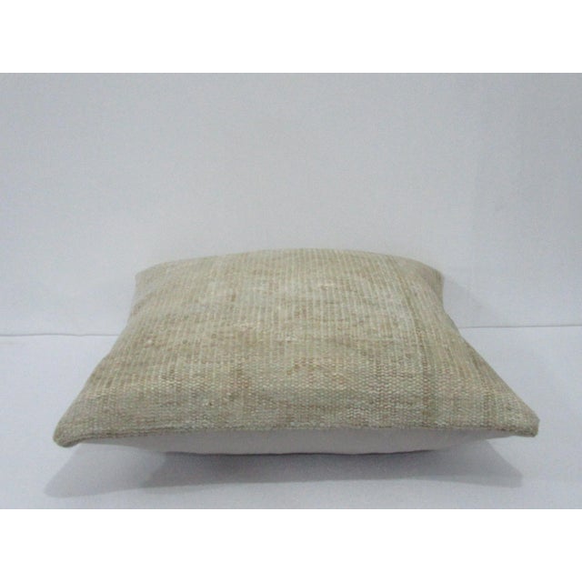 Decorative pillow cover made from a vintage Turkish handknotted rug. Backed with good quality cotton fabric. Pillow...