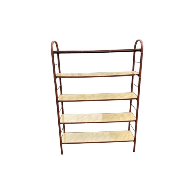 A Rare French Midcentury Modern hand stitched bookcase tools by Jacques Adnet, circa 1955. Adnet had a rare talent for...