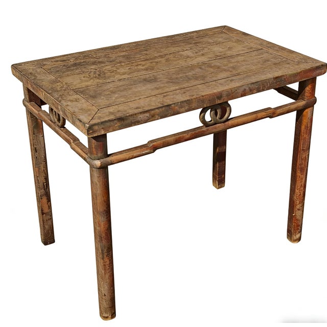 This rectangular side table is made from solid elm with a weathered, natural finish. The design features a recessed apron...