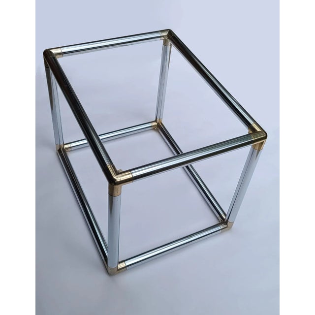 This cocktail table is framed in strong chrome steel with brass-tone corner caps. It's totally tubular at a diameter of...