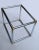 This cocktail table is framed in strong chrome steel with brass-tone corner caps. It's totally tubular at a diameter of...