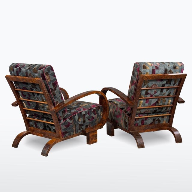 Elegant pair of Art Deco armchairs from the 1930s featuring beautifully curved bentwood armrests and a refined geometric...