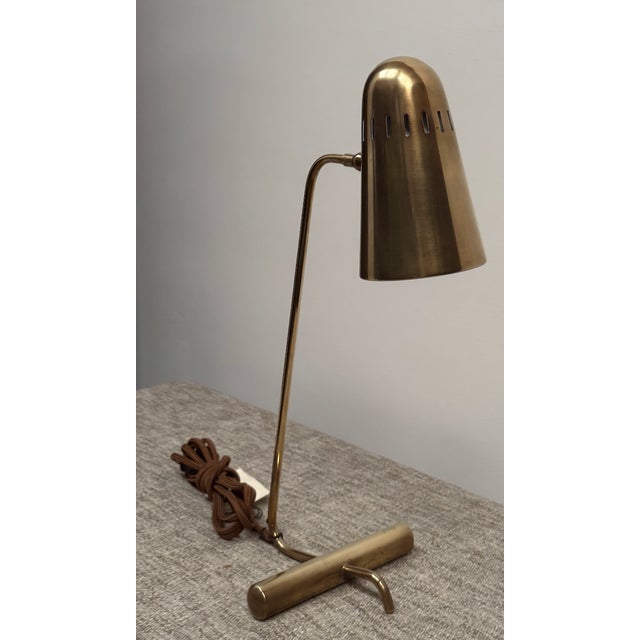 Brass desk lamp / task light by Visual Comfort(brand not indicated on the item). Natural brass finish with braided cord.