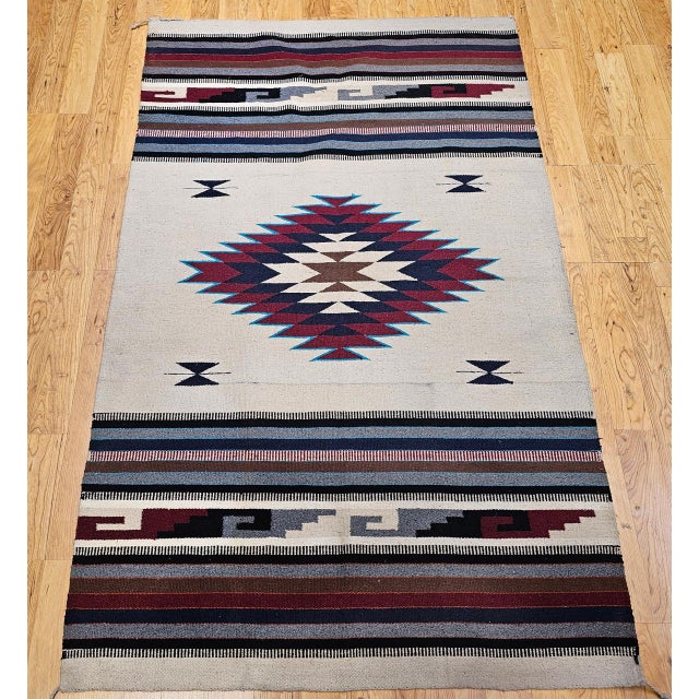 Bring authentic Southwestern charm into your space with this vintage Saltillo kilim rug, beautifully handwoven in the...