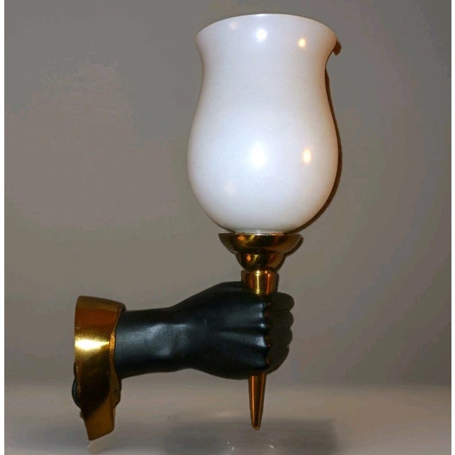 c1950 French Hollywood Regency Gilt and Patinated Bronze Hand Torch Wall Sconce by Andre Arbus. Beautiful condition and...