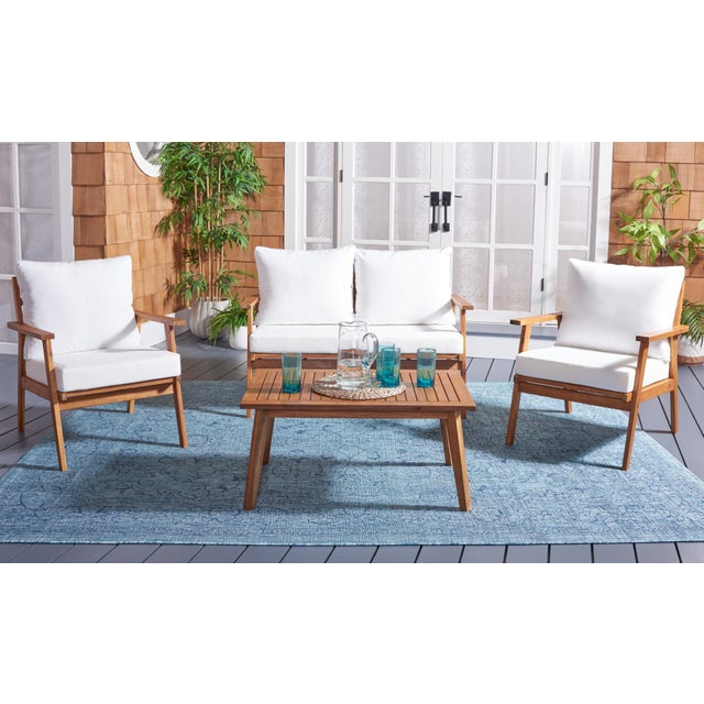 The open and airy design of the Rocklin 4 Piece Outdoor Set beautifully combines form and function. Its slatted silhouette...