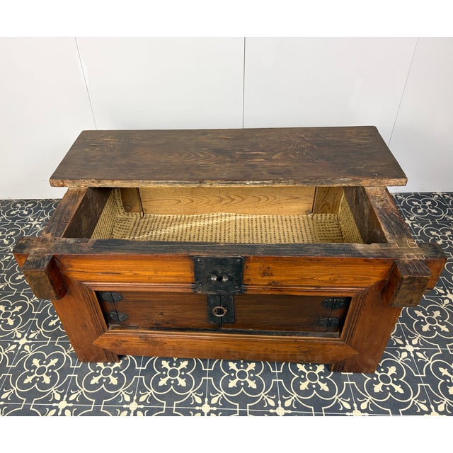 This exceptional antique Korean Ssal-Duiji (Rice Chest) is a striking testament to traditional craftsmanship, seamlessly...