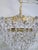 Vintage Brass and Glass Rosette Rim and Crystal Prism Chandelier For Sale - Image 4 of 12