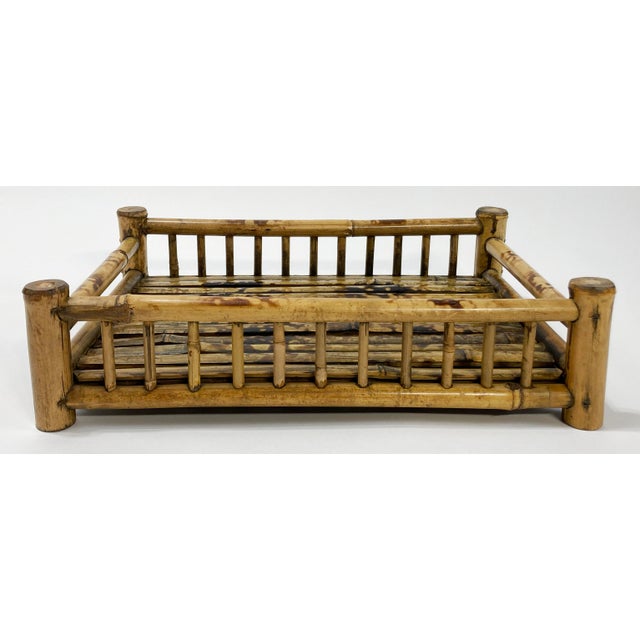 Vintage rectangular footed split reed tray featuring rich burnt tortoise shell finish. Age wear.