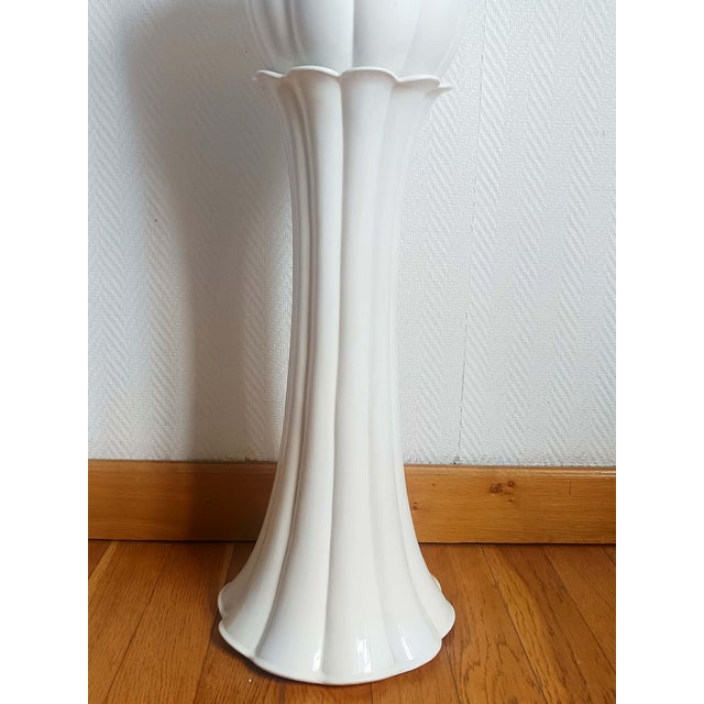 Vintage Italian planter, circa 1970. This planter, with its tulip-shaped, gadrooned base, is made of white glazed...