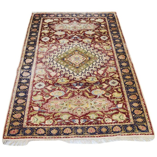 Hand-knotted with care using traditional rug-making techniques, this wool rug blends timeless craftsmanship with a modern...