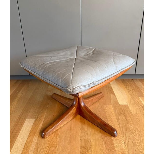 Wonderful mid century Scandinavian Modern wood and grey leather footstool or ottoman in the style of Soda Galvano for Lied...
