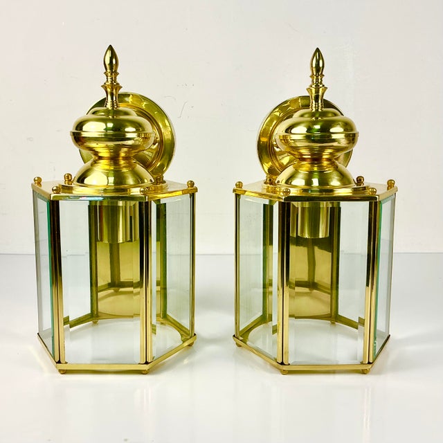 This pair of vintage wall lantern style sconces are in very good condition. They are six-sided and feature beveled cut...