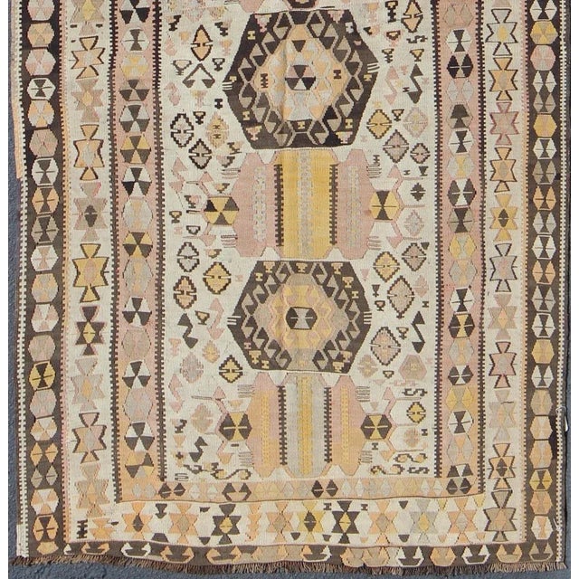 Tribal Mid 20th Century Mid 20th Century Vintage Turkish Kilim Gallery Rug With Tribal Design in Brown Pink and Yellow For Sale - Image 3 of 13