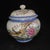 A lovely pair of Chinese Famille Rose porcelain covered jars. The white ground is finely hand-painted with vibrant birds...