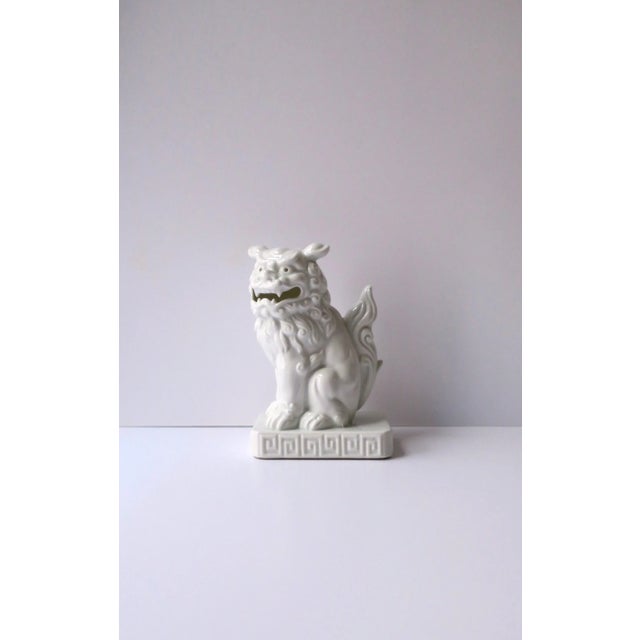 A beautiful white porcelain foo dog lion decorative object or bookend, circa early to mid-20th century, Japan. Foo dog...