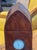 Gothic mantel clock with a lancet-arched case, the front inlaid with a pointed arch tracery design above and radiating...