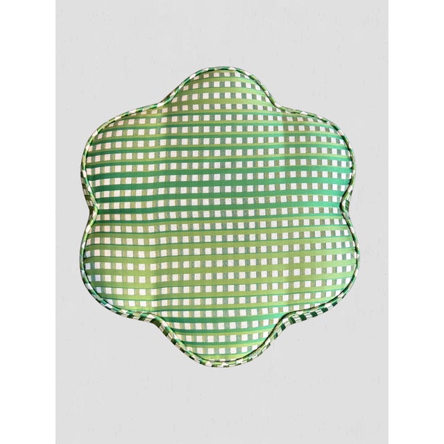 A soft, sculptural silhouette meets classic charm. This custom ottoman features a gently curved, petal-inspired shape...