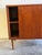 Beautiful vintage Mid Century Modern Danish sideboard crafted in warm teak wood, showcasing timeless Scandinavian design...