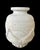the hand-carved, solid marble urn in the classical taste with short everted neck above a tapering body adorned with relief...