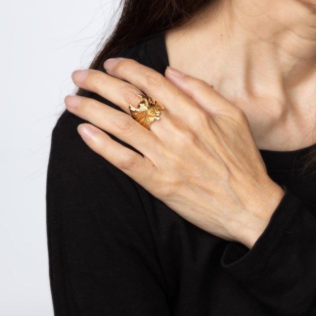 Stylish pre-owned Carrera y Carrera diamond masked angel ring crafted in 18k yellow gold. Diamond totals an estimated 0.06...