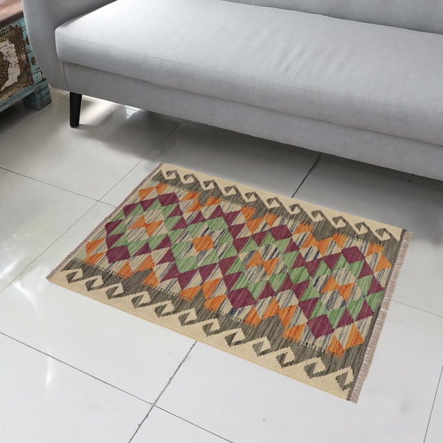 Elevate the elegance of your home with this stunning hand-woven tribal Kilim wool rug. Meticulously crafted on a loom by...